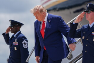 President Donald Trump arrives on Air Force One at Dobbins Air Reserve Base, Wednesday, July 22, 2026, in Marietta, Ga. (AP Photo/Julia Demaree Nikhinson)