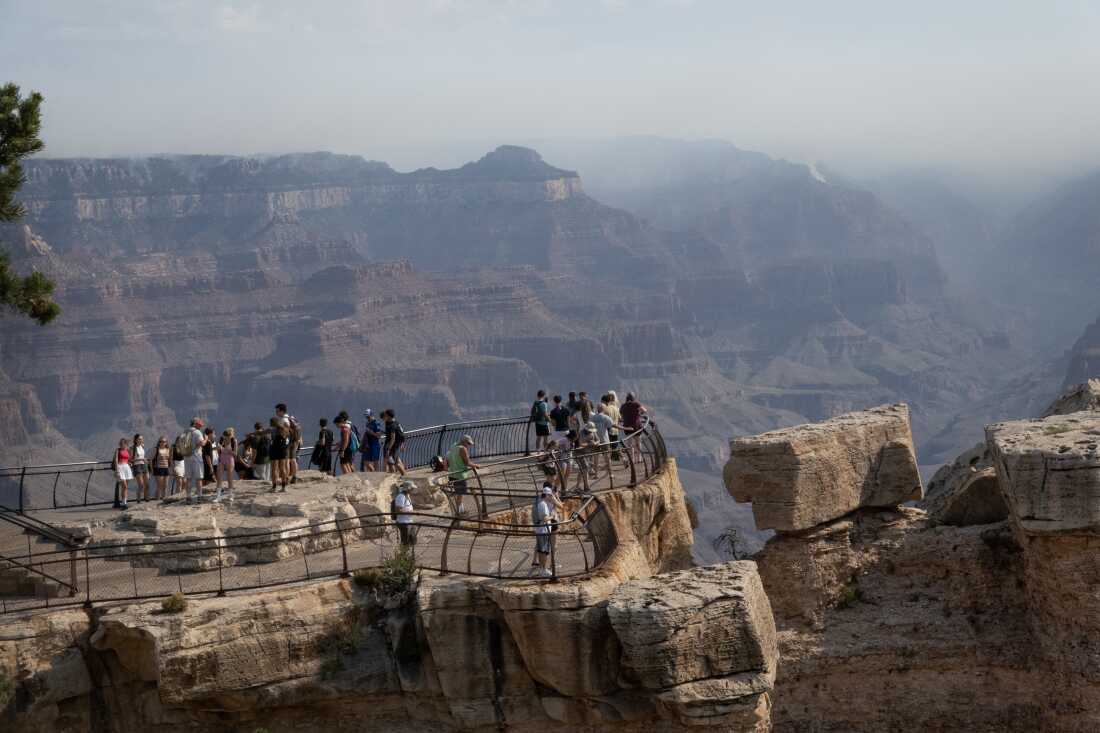 Tourists take in the Grand Canyon.